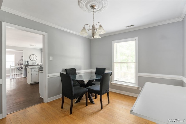 2207 Turtle Hill Cir, Midlothian, VA 23112 - dining area featuring a chandelier, light wood finished floors, baseboards, and ornamental molding
