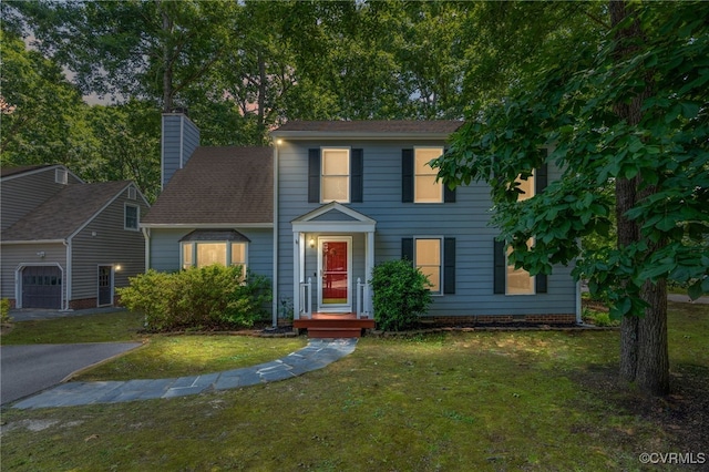 2207 Turtle Hill Cir, Midlothian, VA 23112 - colonial home with a garage, a front lawn, and a chimney