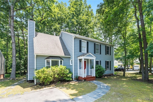 2207 Turtle Hill Cir, Midlothian, VA 23112 - view of front facade featuring a chimney, a shingled roof, and a front lawn