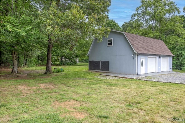5 Walters Way, Bumpass, VA 23024 - view of property exterior featuring a gambrel roof, a garage, a lawn, an outbuilding, and a shingled roof