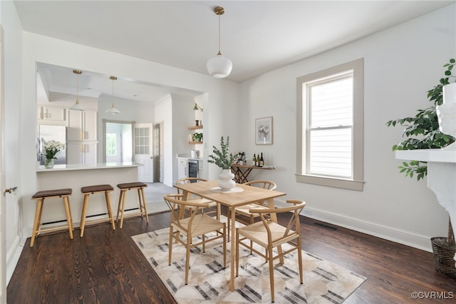 1500 N 23rd St, Richmond, VA 23223 - dining area with dark wood-style flooring, wine cooler, and a baseboard heating unit