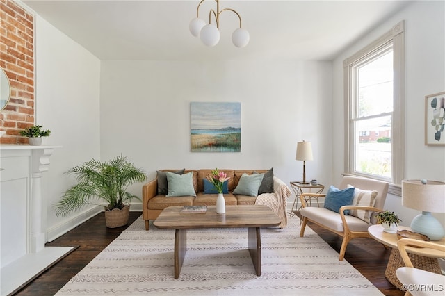 1500 N 23rd St, Richmond, VA 23223 - living area featuring dark wood-style floors, healthy amount of natural light, and a chandelier