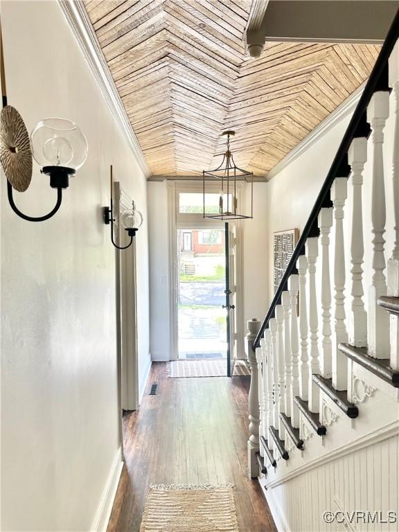 1500 N 23rd St, Richmond, VA 23223 - entrance foyer featuring ornamental molding, dark wood-type flooring, stairs, a chandelier, and wood ceiling