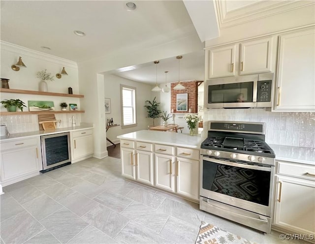 1500 N 23rd St, Richmond, VA 23223 - kitchen with appliances with stainless steel finishes, wine cooler, light countertops, backsplash, and ornamental molding