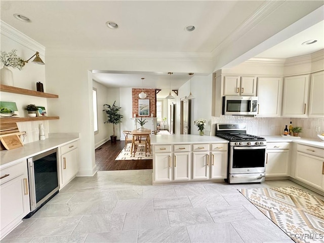 1500 N 23rd St, Richmond, VA 23223 - kitchen with stainless steel appliances, beverage cooler, crown molding, light countertops, and tasteful backsplash
