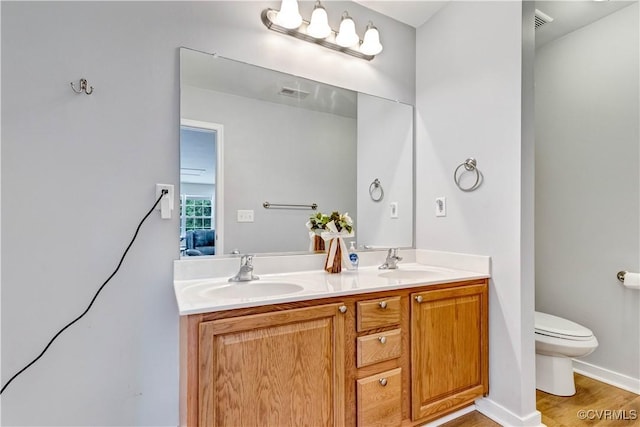 8118 Mimosa Hill Ln, Mechanicsville, VA 23116 - bathroom featuring double vanity and wood finished floors