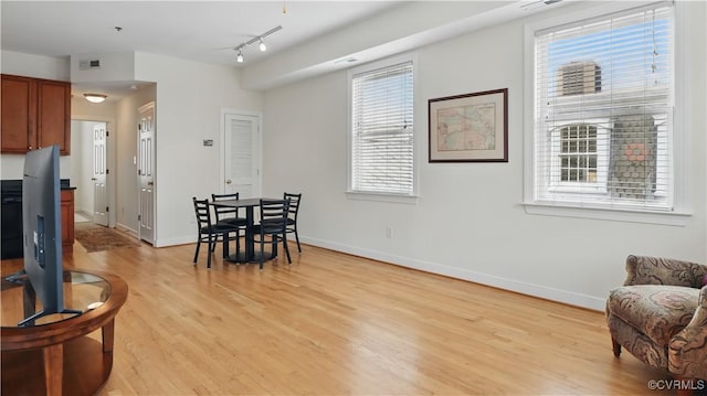 1901 E Broad St Unit U31, Richmond, VA 23223 - dining room featuring light wood-style floors, baseboards, and track lighting