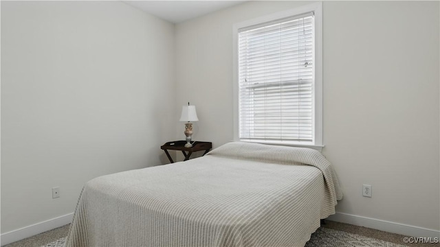 1901 E Broad St Unit U31, Richmond, VA 23223 - carpeted bedroom featuring baseboards