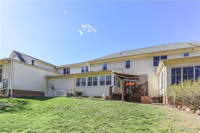 10003 Four Iron Ct, Fredericksburg, VA 22408 - rear view of property with a sunroom, a yard, and a wooden deck