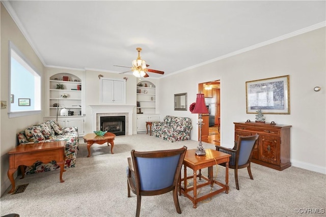 10003 Four Iron Ct, Fredericksburg, VA 22408 - carpeted living area with ornamental molding, built in features, ceiling fan, a fireplace, and baseboards