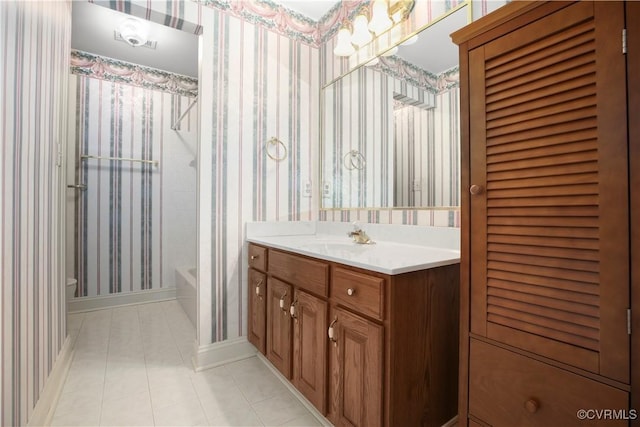 10003 Four Iron Ct, Fredericksburg, VA 22408 - full bathroom with tile patterned floors, baseboards, wallpapered walls, toilet, and vanity