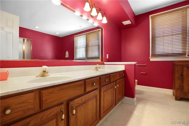 10003 Four Iron Ct, Fredericksburg, VA 22408 - bathroom featuring double vanity, baseboards, tile patterned flooring, and toilet