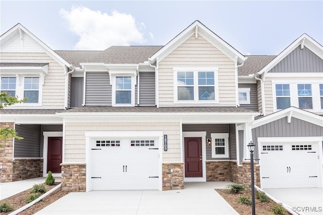 18709 Palisades Cove Trl, Moseley, VA 23120 - view of front facade featuring driveway, a shingled roof, a garage, and stone siding