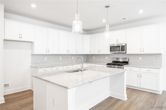 18709 Palisades Cove Trl, Moseley, VA 23120 - kitchen featuring appliances with stainless steel finishes, light wood-style floors, white cabinets, and recessed lighting