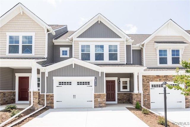 18713 Palisades Cove Trl, Moseley, VA 23120 - view of front of property featuring concrete driveway, board and batten siding, and stone siding
