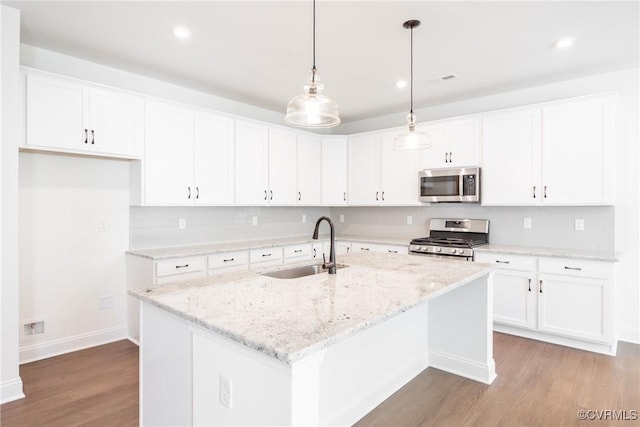 18713 Palisades Cove Trl, Moseley, VA 23120 - kitchen featuring stainless steel appliances, wood finished floors, backsplash, white cabinetry, and recessed lighting