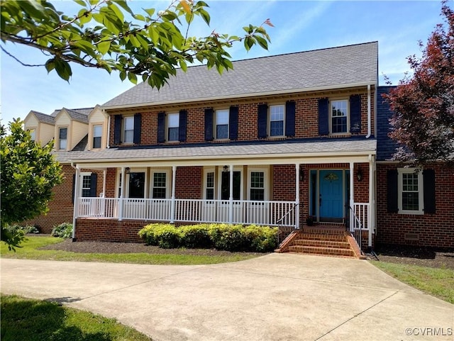 3249 N Maidens Rd, Maidens, VA 23139 - view of front of home featuring a porch, brick siding, and roof with shingles