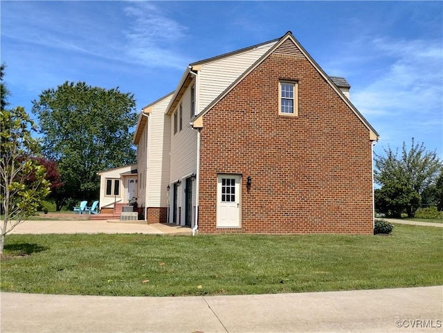 3249 N Maidens Rd, Maidens, VA 23139 - view of side of property featuring a yard, a patio, an attached garage, and entry steps