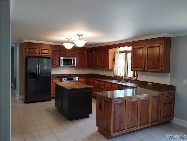 3249 N Maidens Rd, Maidens, VA 23139 - kitchen featuring stainless steel appliances, a sink, a peninsula, dark stone counters, and a kitchen island