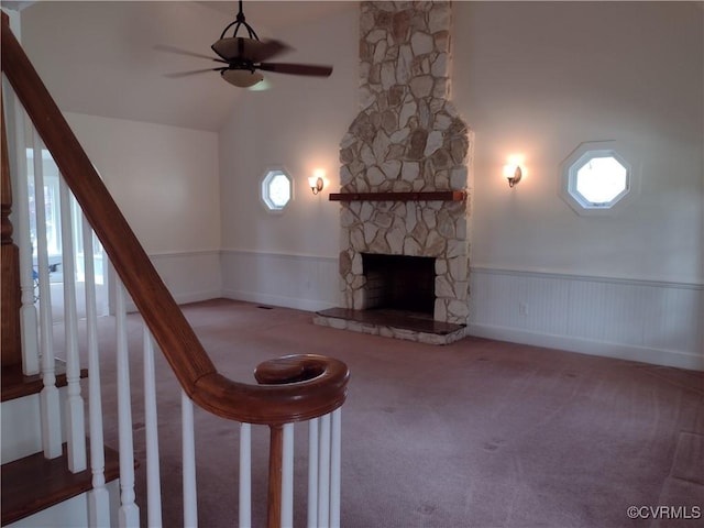 3249 N Maidens Rd, Maidens, VA 23139 - unfurnished living room featuring a wainscoted wall, ceiling fan, a stone fireplace, carpet, and stairway