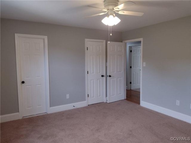 3249 N Maidens Rd, Maidens, VA 23139 - unfurnished bedroom with carpet floors, baseboards, and two closets