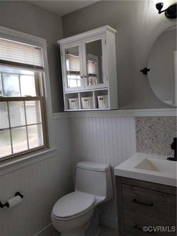 3249 N Maidens Rd, Maidens, VA 23139 - half bathroom featuring toilet, healthy amount of natural light, vanity, and wainscoting