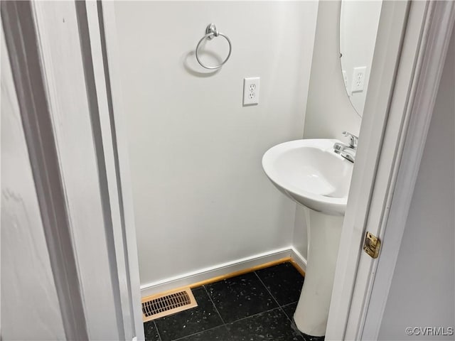 8069 Kiwi Ln, Mechanicsville, VA 23111 - bathroom featuring tile patterned flooring, baseboards, and a sink