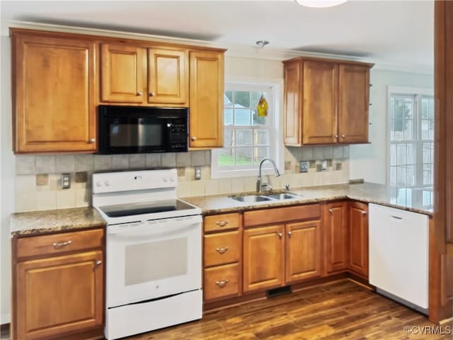 8069 Kiwi Ln, Mechanicsville, VA 23111 - kitchen featuring white appliances, a sink, tasteful backsplash, dark wood-style floors, and brown cabinets