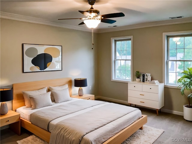 8069 Kiwi Ln, Mechanicsville, VA 23111 - bedroom with multiple windows, baseboards, crown molding, light wood finished floors, and ceiling fan