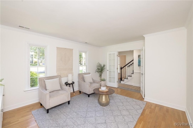 13119 Glenmeadow Ct, Midlothian, VA 23114 - living area with plenty of natural light, wood finished floors, stairway, and crown molding