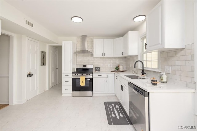 13119 Glenmeadow Ct, Midlothian, VA 23114 - kitchen with stainless steel appliances, wall chimney range hood, a sink, white cabinets, and decorative backsplash