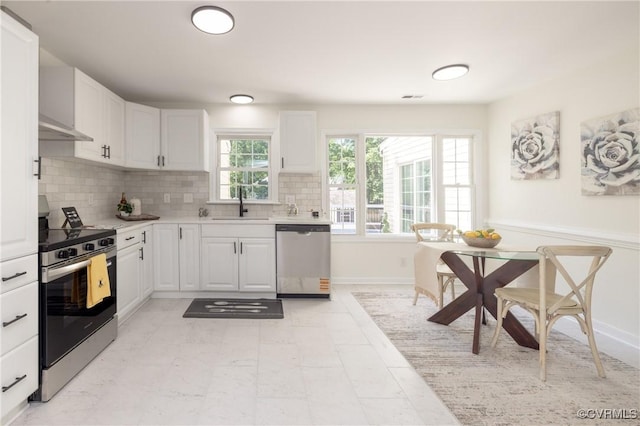 13119 Glenmeadow Ct, Midlothian, VA 23114 - kitchen with appliances with stainless steel finishes, a sink, white cabinetry, and backsplash
