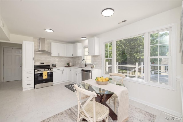 13119 Glenmeadow Ct, Midlothian, VA 23114 - kitchen with appliances with stainless steel finishes, wall chimney exhaust hood, light countertops, backsplash, and white cabinets