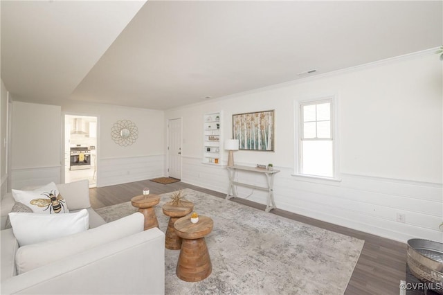13119 Glenmeadow Ct, Midlothian, VA 23114 - living room featuring wood finished floors, a wainscoted wall, ornamental molding, and baseboards
