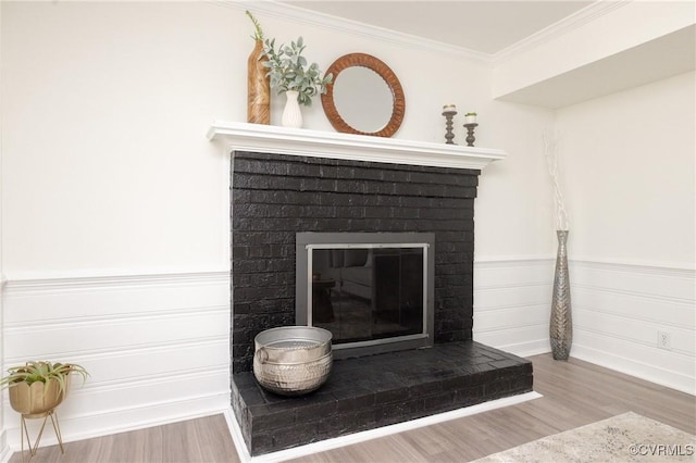 13119 Glenmeadow Ct, Midlothian, VA 23114 - detailed view of a brick fireplace, wood finished floors, ornamental molding, and a wainscoted wall