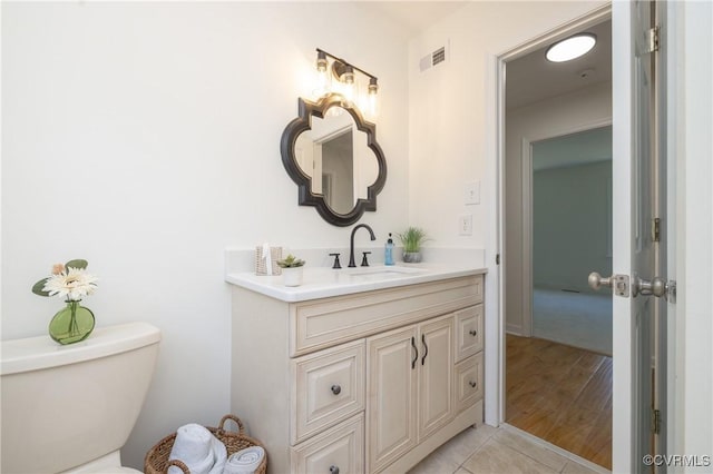 13119 Glenmeadow Ct, Midlothian, VA 23114 - half bathroom with vanity, toilet, and wood finished floors