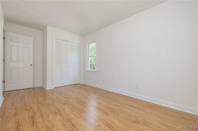 13119 Glenmeadow Ct, Midlothian, VA 23114 - unfurnished bedroom featuring baseboards, light wood-type flooring, and a closet