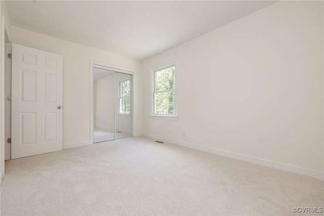 13119 Glenmeadow Ct, Midlothian, VA 23114 - unfurnished bedroom with light colored carpet, baseboards, and a closet