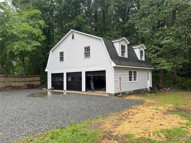 23766 Kings Hwy, Warsaw, VA 22572 - garage featuring view of scattered trees and a garage