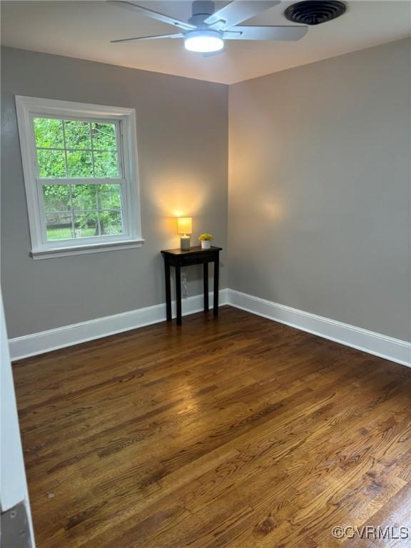 23766 Kings Hwy, Warsaw, VA 22572 - unfurnished room with a ceiling fan, baseboards, and dark wood-style flooring