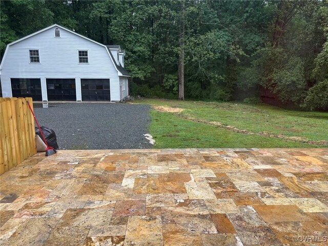 23766 Kings Hwy, Warsaw, VA 22572 - garage featuring a garage and a forest view