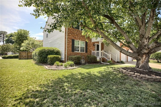 802 Westgate Ct, Newport News, VA 23602 - obstructed view of property featuring brick siding, a garage, and driveway