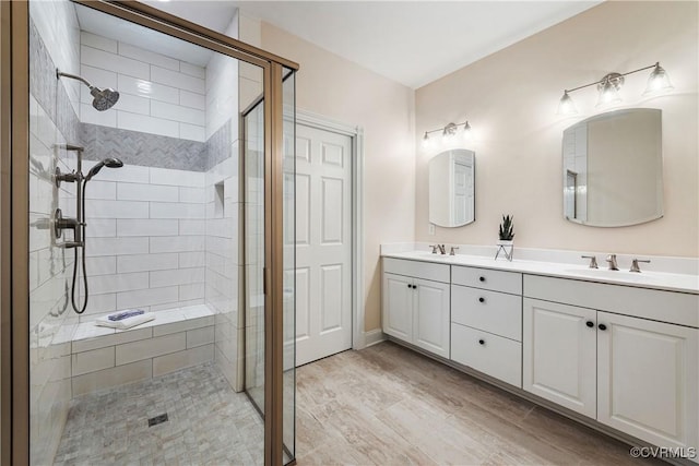 3904 Ambergrove Ave, Chesterfield, VA 23236 - bathroom with a stall shower, double vanity, and wood finished floors