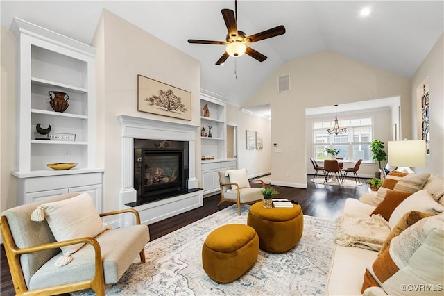 3904 Ambergrove Ave, Chesterfield, VA 23236 - living room featuring dark wood finished floors, ceiling fan, a glass covered fireplace, a chandelier, and baseboards