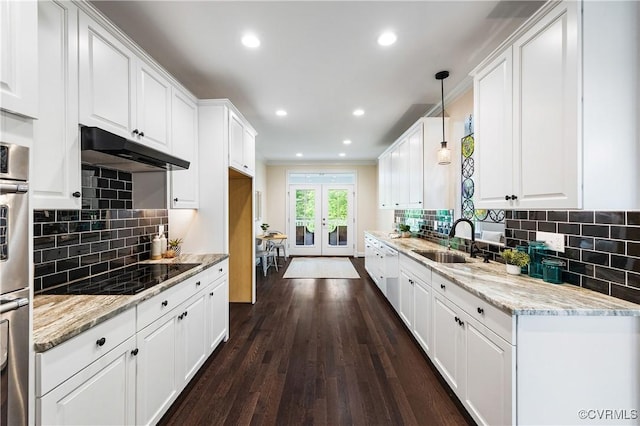 3904 Ambergrove Ave, Chesterfield, VA 23236 - kitchen with black electric stovetop, under cabinet range hood, french doors, white cabinets, and recessed lighting