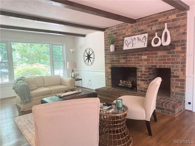 4204 Poplar Grove Ter, Chesterfield, VA 23112 - living room featuring wood finished floors, a brick fireplace, beam ceiling, and a wainscoted wall