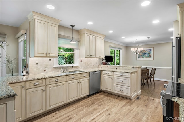 2020 Running Brook Ln, Midlothian, VA 23113 - kitchen with a sink, stainless steel appliances, a peninsula, tasteful backsplash, and cream cabinetry