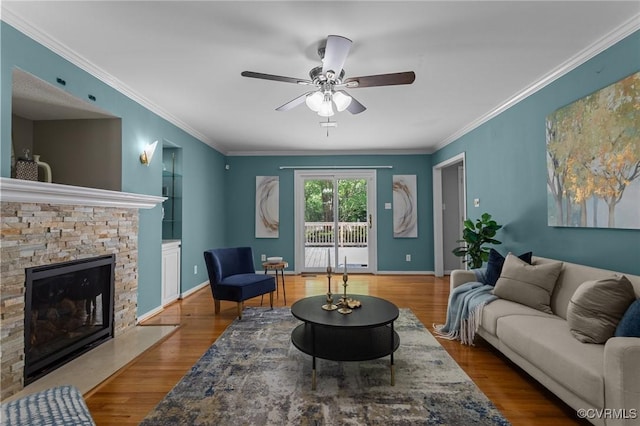 6730 Bryanbell Dr, North Chesterfield, VA 23234 - living room featuring a ceiling fan, wood finished floors, a fireplace, crown molding, and baseboards