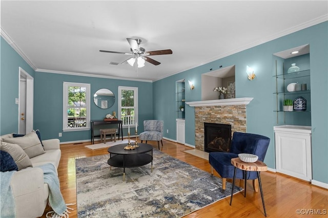 6730 Bryanbell Dr, North Chesterfield, VA 23234 - living area featuring wood finished floors, crown molding, ceiling fan, a fireplace, and built in features