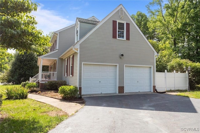 6730 Bryanbell Dr, North Chesterfield, VA 23234 - view of property exterior featuring driveway, a garage, and covered porch
